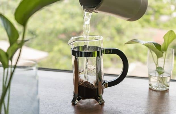 Hot water pouring into a French press carafe