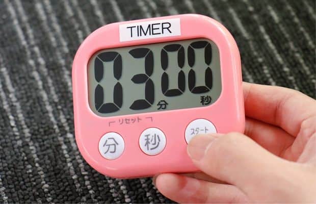 Pink digital timer set to three minutes
