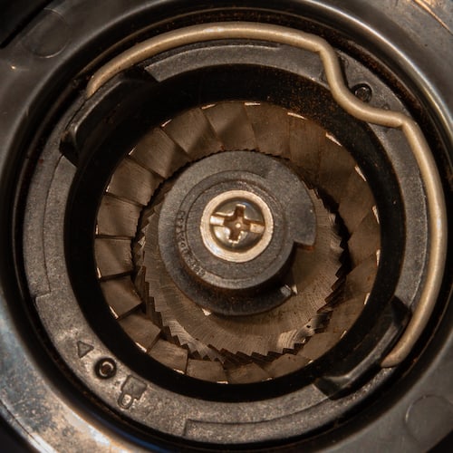 Seasoned burrs on a coffee grinder