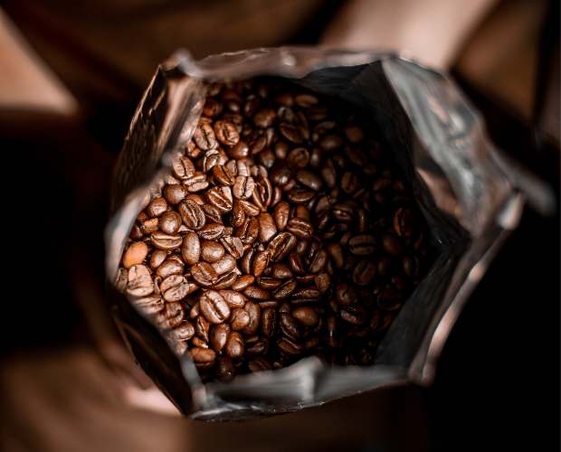 View into the top of a bag of coffee beans