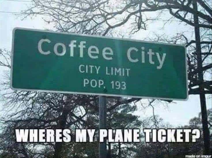 Traffic sign announcing Coffee City city limits, with caption: Where's my plane ticket?