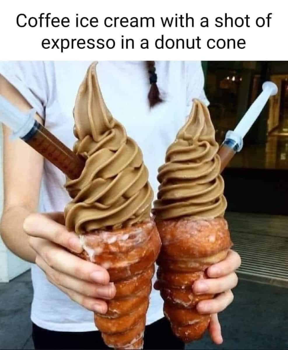 Person holding two treats that are as described in the caption: Coffee ice cream with a shot of espresso in a donut cone.