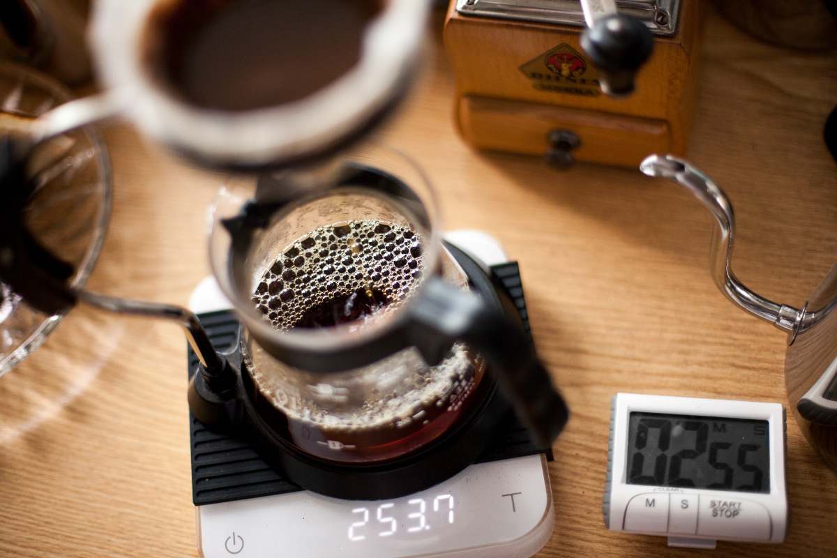 Coffee brewing next to a digital timer