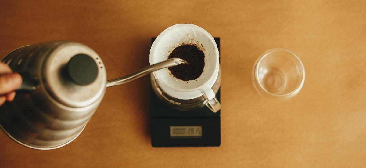 Overhead shot of a pour-over coffee setup on a precision scale