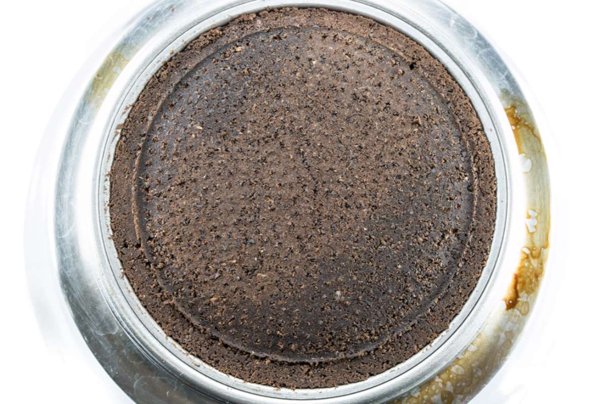A puck of coffee grounds in a moka pot